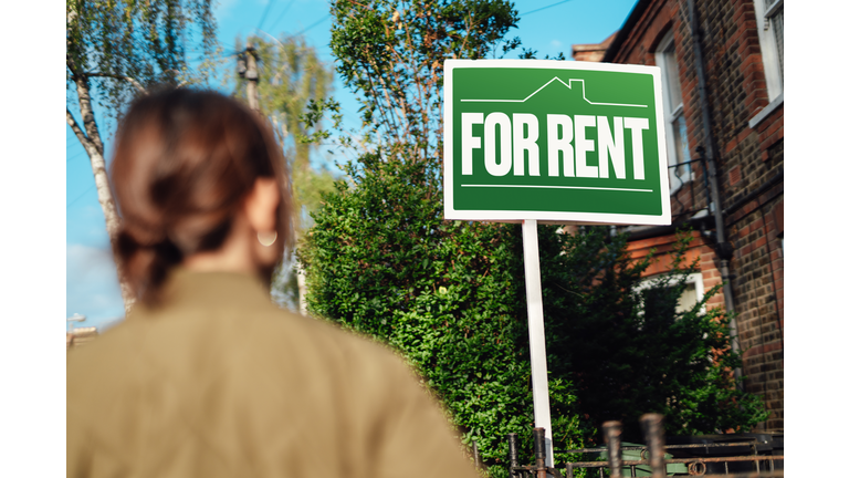 Home for rent with real estate sign