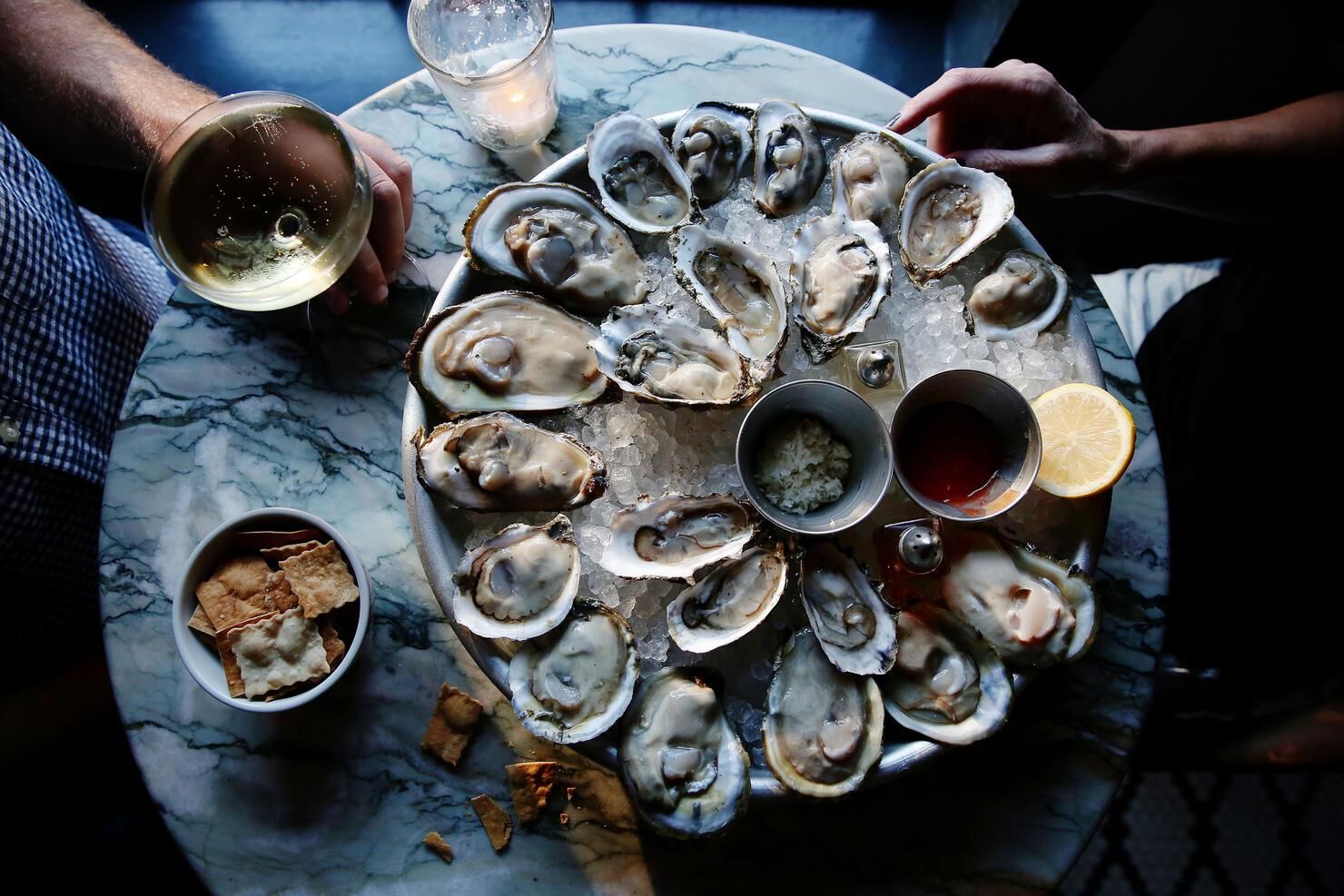 A couple enjoying raw oysters