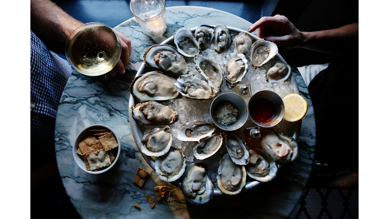 A couple enjoying raw oysters