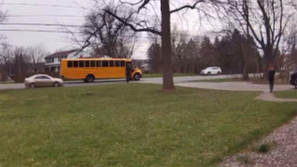 WATCH: Car Speeds Around School Bus, Drives On Lawn As Girl Is Getting Off