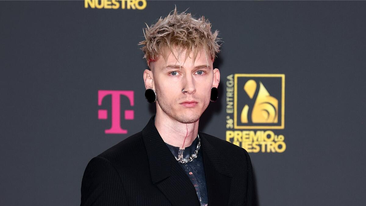 WATCH: MGK Shows Off Brutal Process For 'Most Painful' Blackout Tattoo ...