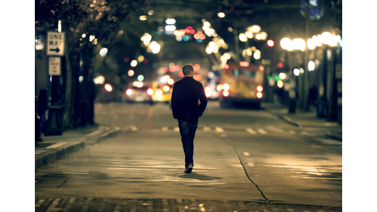 Silhouette walking in downtown seattle