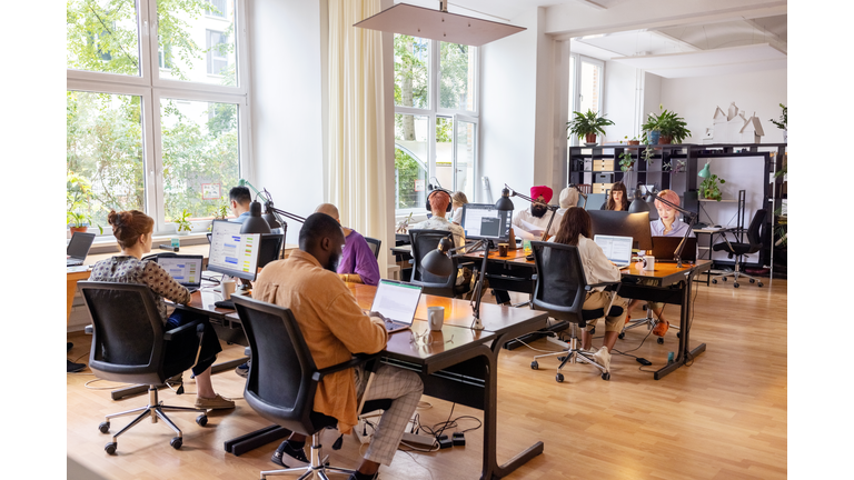 Creative business team working in an open plan office