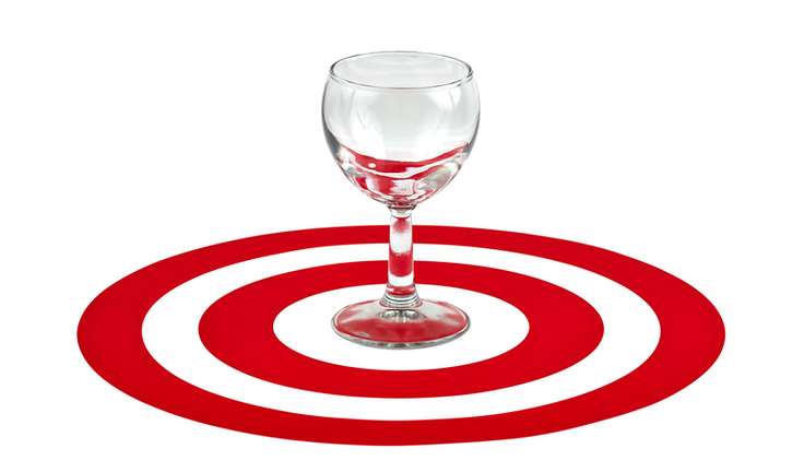 Wine glass in the center of red target