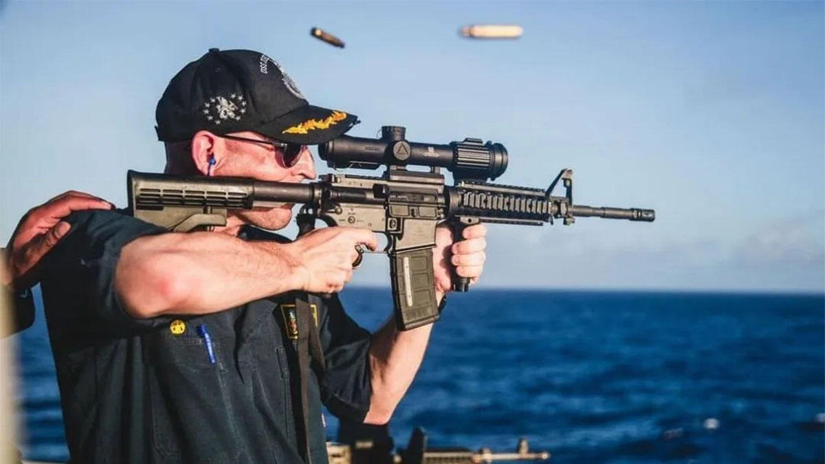 Navy Pulls Down Photo Showing Commander Firing Rifle With Glaring ...