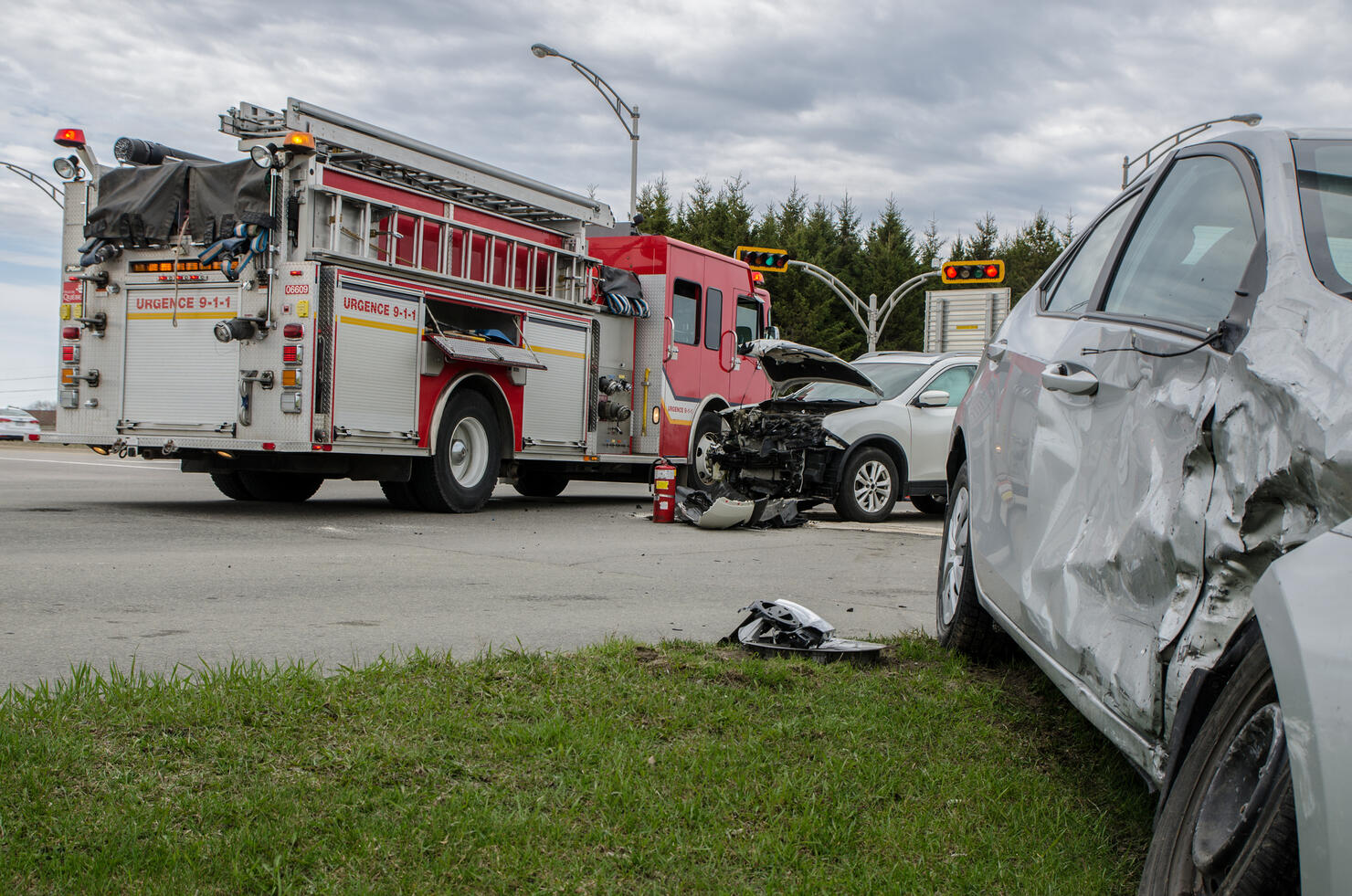 Two cars crashed in accident with firetruck behind