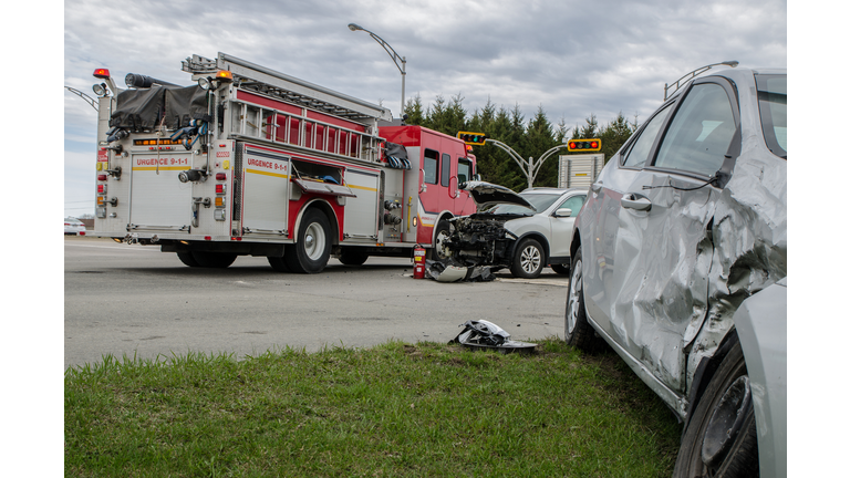 Two cars crashed in accident with firetruck behind