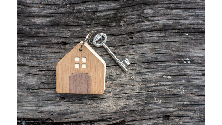 House  keys on wooden floor background