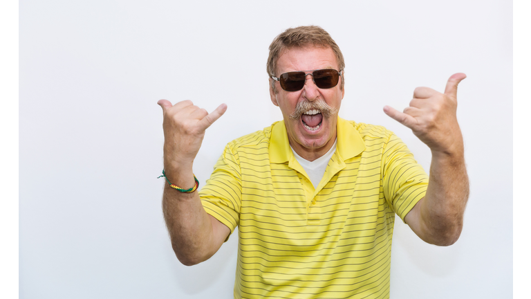 Portrait of senior old man exited funky funny comic guy gesture his hands as a rocker. Elderly nerd grandfather rock music lover fan, happy cheerful lifestyle after retirement concept