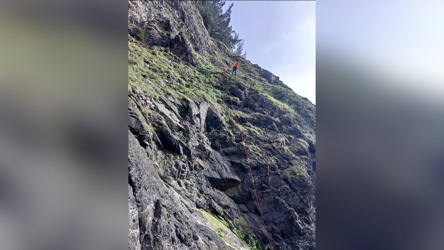 A rescue crew rappels down a cliff in Oregon