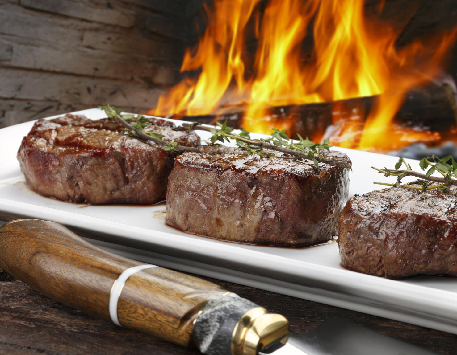 Three steaks roasted on the grill