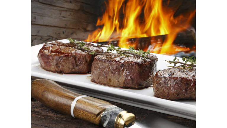 Three steaks roasted on the grill