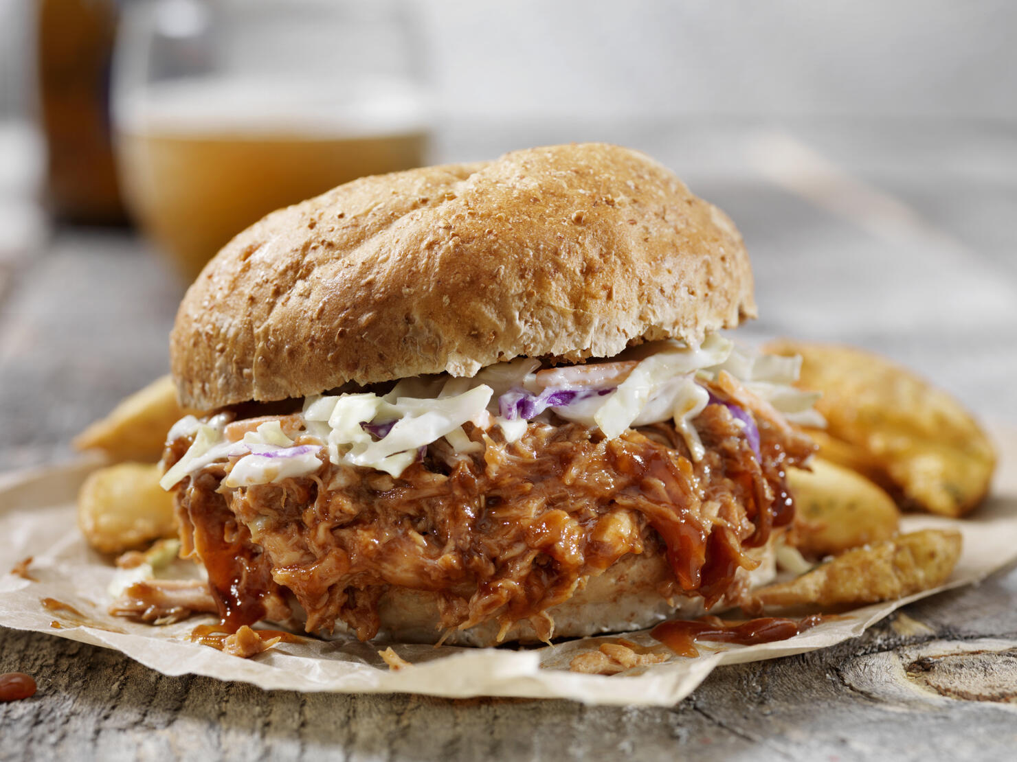 Pulled Pork Sandwich with Creamy Coleslaw, Thick Cut Fries and a Beer