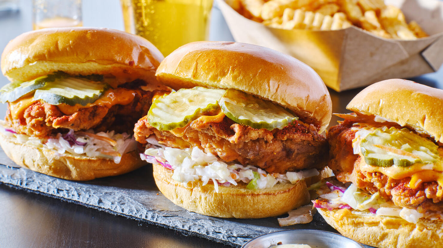spicy nashville hot chicken sandwich with coleslaw and pickles