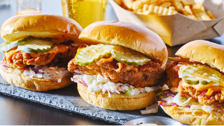 spicy nashville hot chicken sandwich with coleslaw and pickles