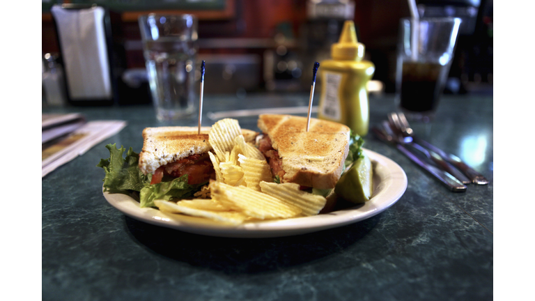 A BLT with ruffled potato chips
