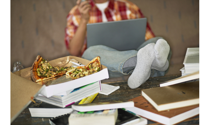 Student with Laptop Eating Pizza