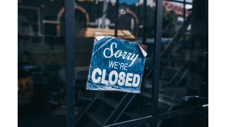 Inscription on a door: Sorry we are closed. Conceptual photo or table on door with information of work. Announcement or work schedule