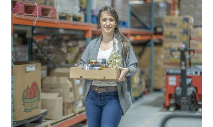 Young woman volunteering at a food bank