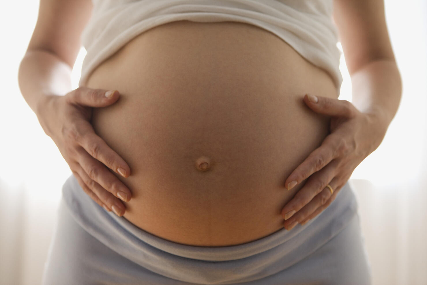 Close up of pregnant woman's belly