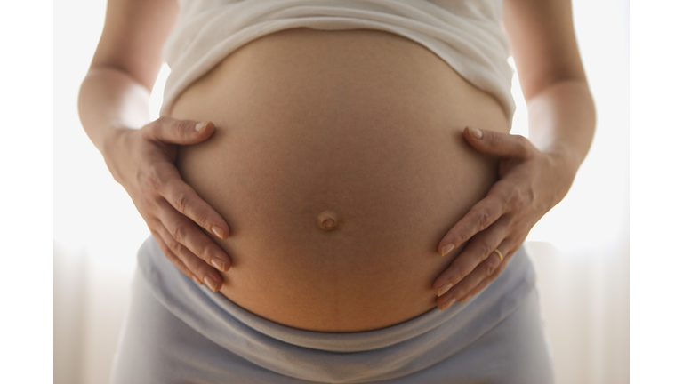 Close up of pregnant woman's belly