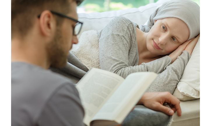 Husband reading to his wife