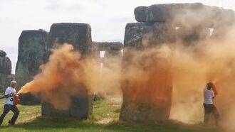 Watch: Environmental Activists Spray Stonehenge with Orange Powder Paint
