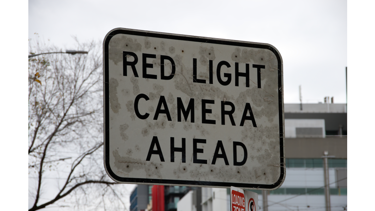 'Red light camera' traffic warning sign