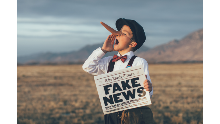 Old Fashioned Pinocchio News Boy Holding Fake Newspaper