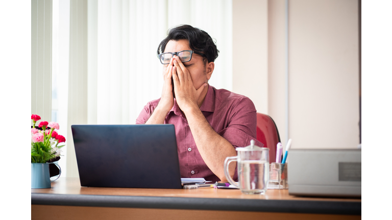 Office Worker Working Late and Looking Stress