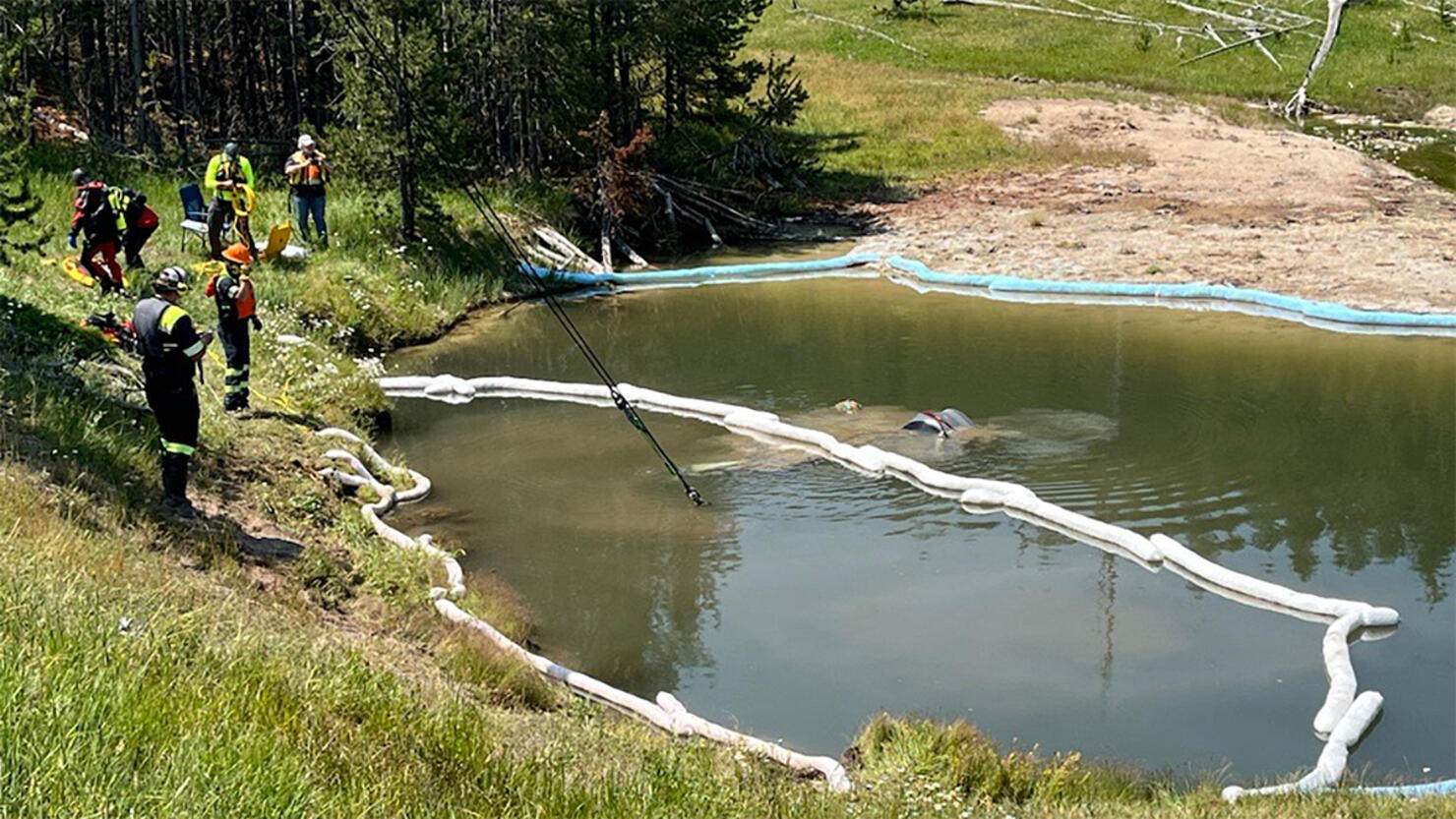 A car is pullled from Yellowstone's Mammoth Hot Springs
