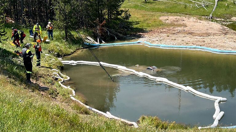 A car is pullled from Yellowstone's Mammoth Hot Springs