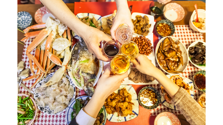 Family are toasting beers and wines over Chinese traditional dishes celebrating for Chinese new year, Tokyo, Japan.