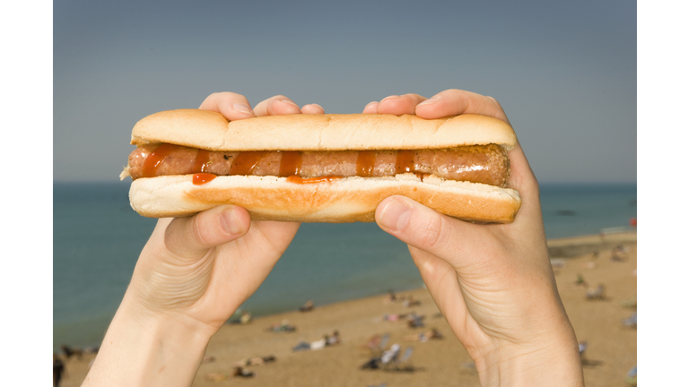 Woman Holding Hot Dog