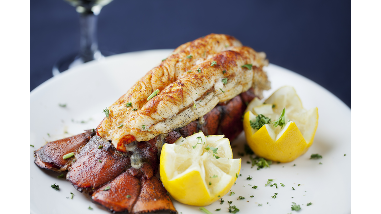 Large lobster tail served with white wine