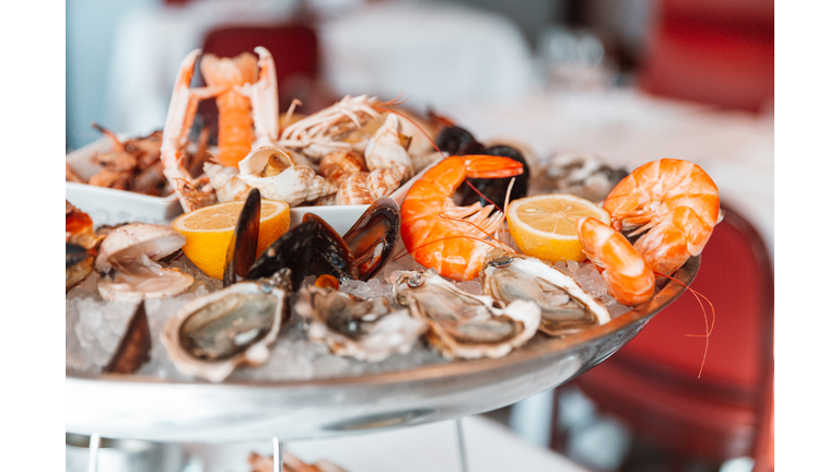 Close-up of a seafood platter with oysters and shrimps in a luxury restaurant