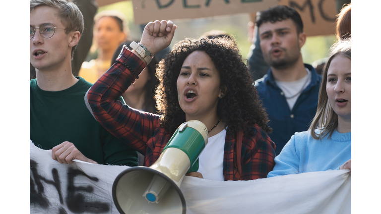 Student Activist Leading Protest with Megaphone