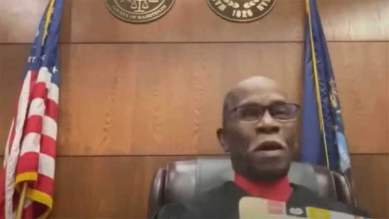 Hon J Cedric Simpson