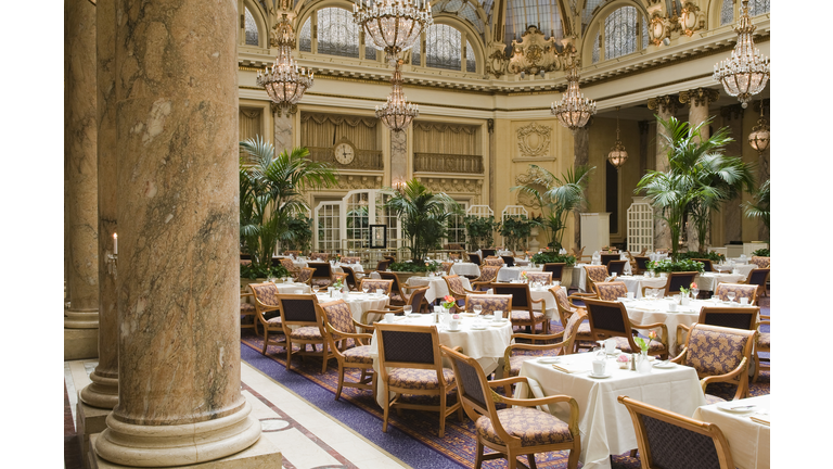 Luxurious restaurant with white tablecloth and marble pillar