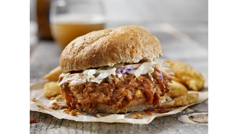 Pulled Pork Sandwich with Creamy Coleslaw, Thick Cut Fries and a Beer