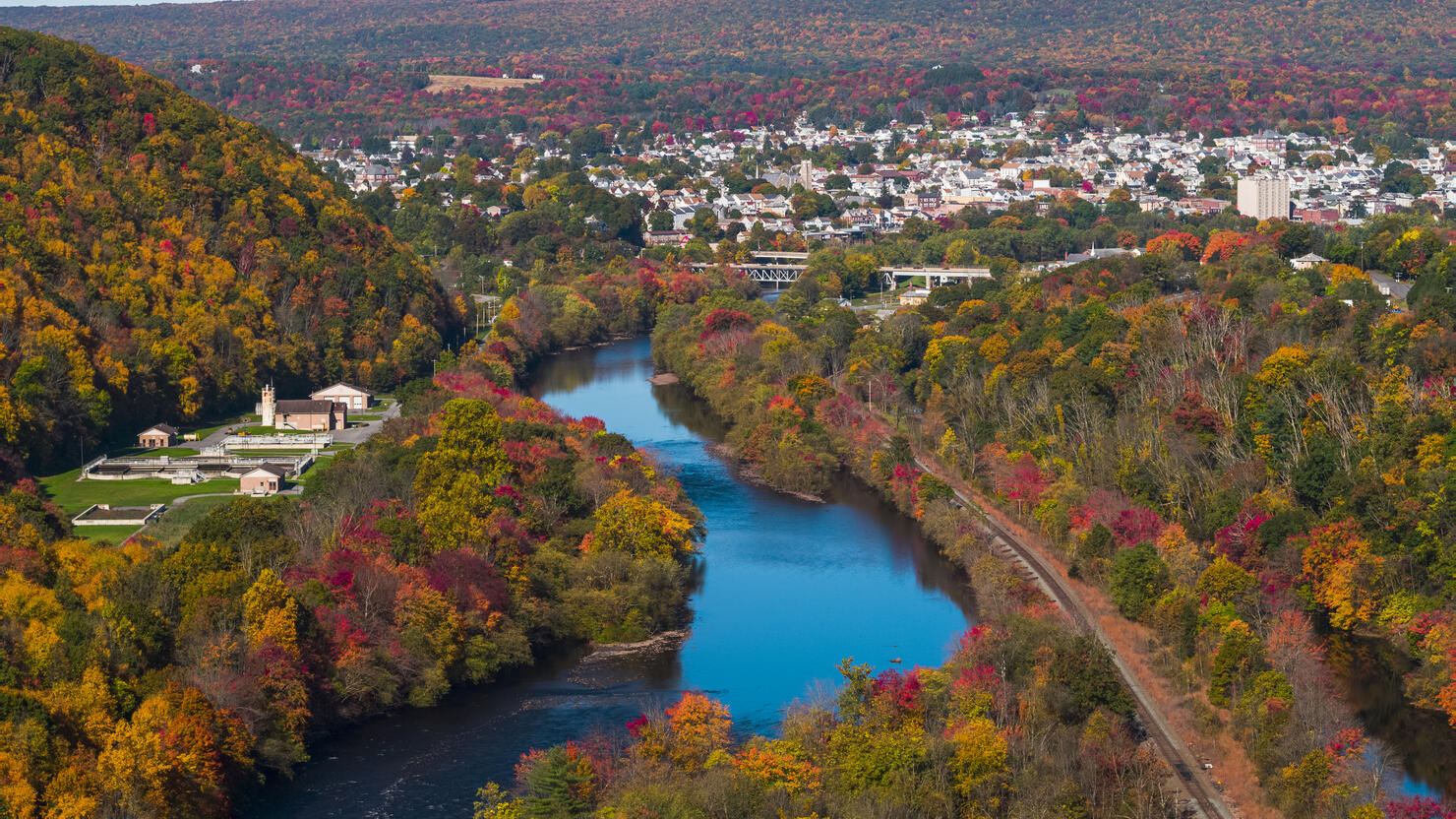 Colorful fall in Appalachian Mountains, Pennsylvania. The aerial remote view on Lehighton along with the Lehigh River.