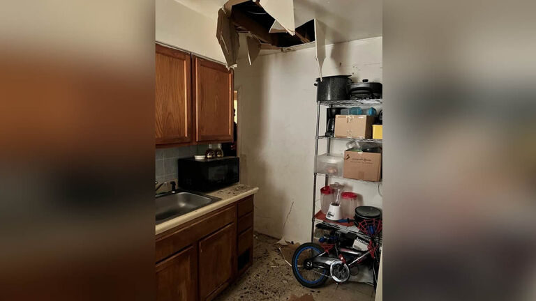 A hole in the ceiling where a murder suspect was hiding