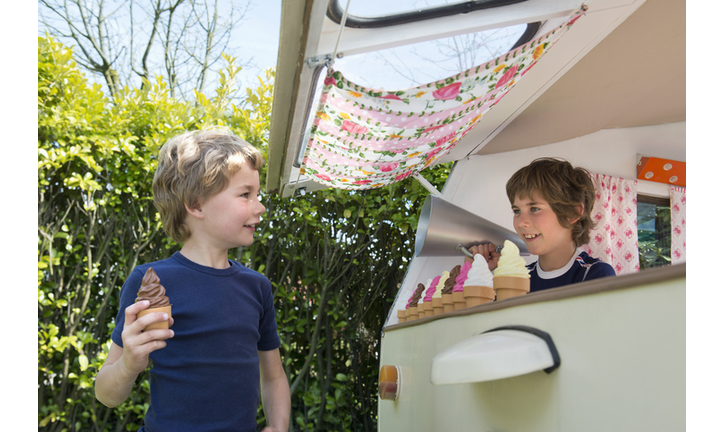 Children playing vendor and customer