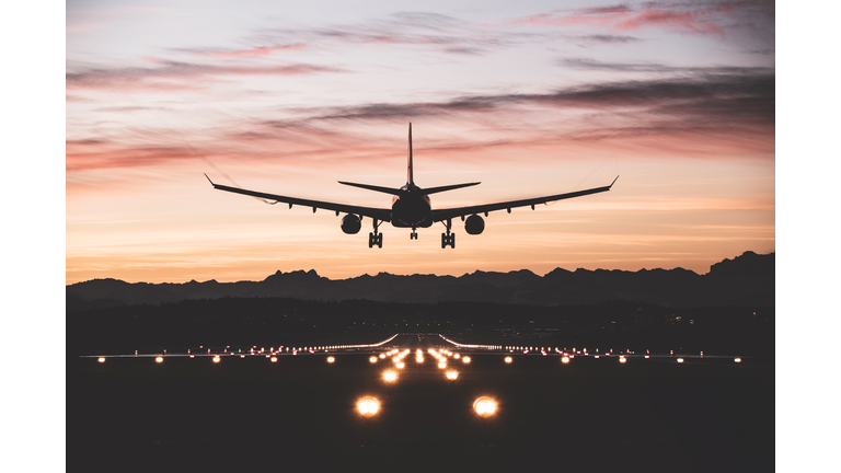 Aircraft landing at sunrise