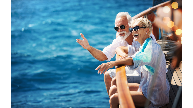 Senior couple on a sailing cruise.
