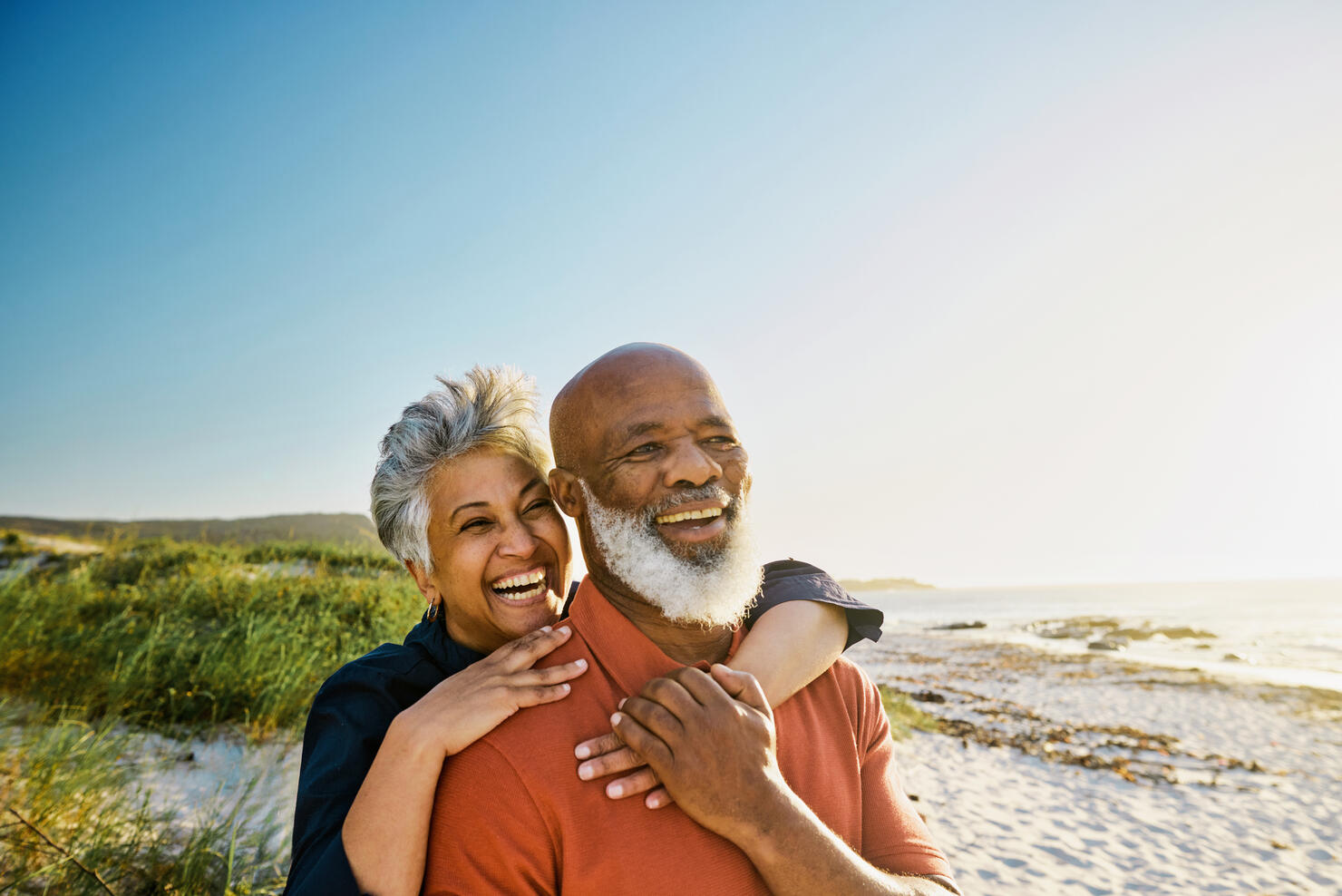 Active Mature African-American Couple Enjoying Retirement and Each Other’s Company at the Beach.