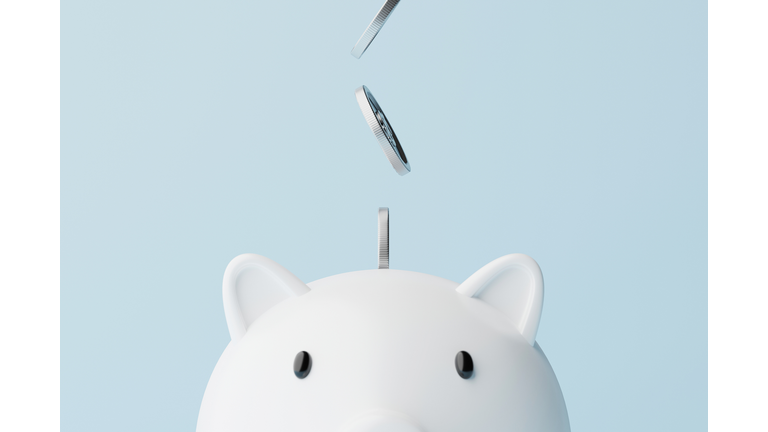 Save money and investment concept. Closeup piggy bank and silver coins falling. 3d rendering illustration
