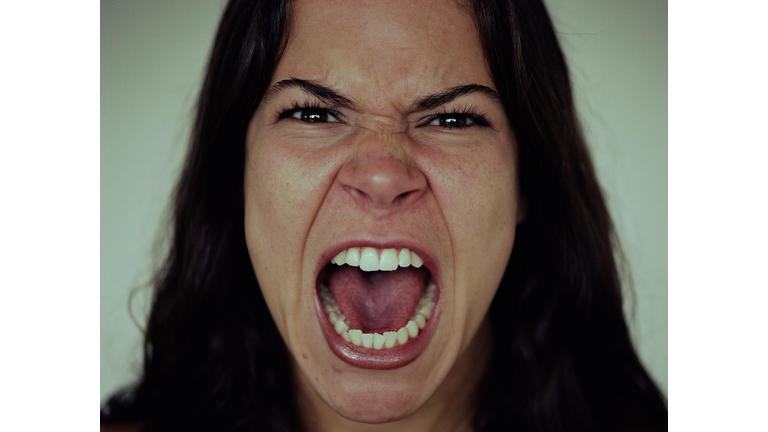 Young woman screaming, close-up