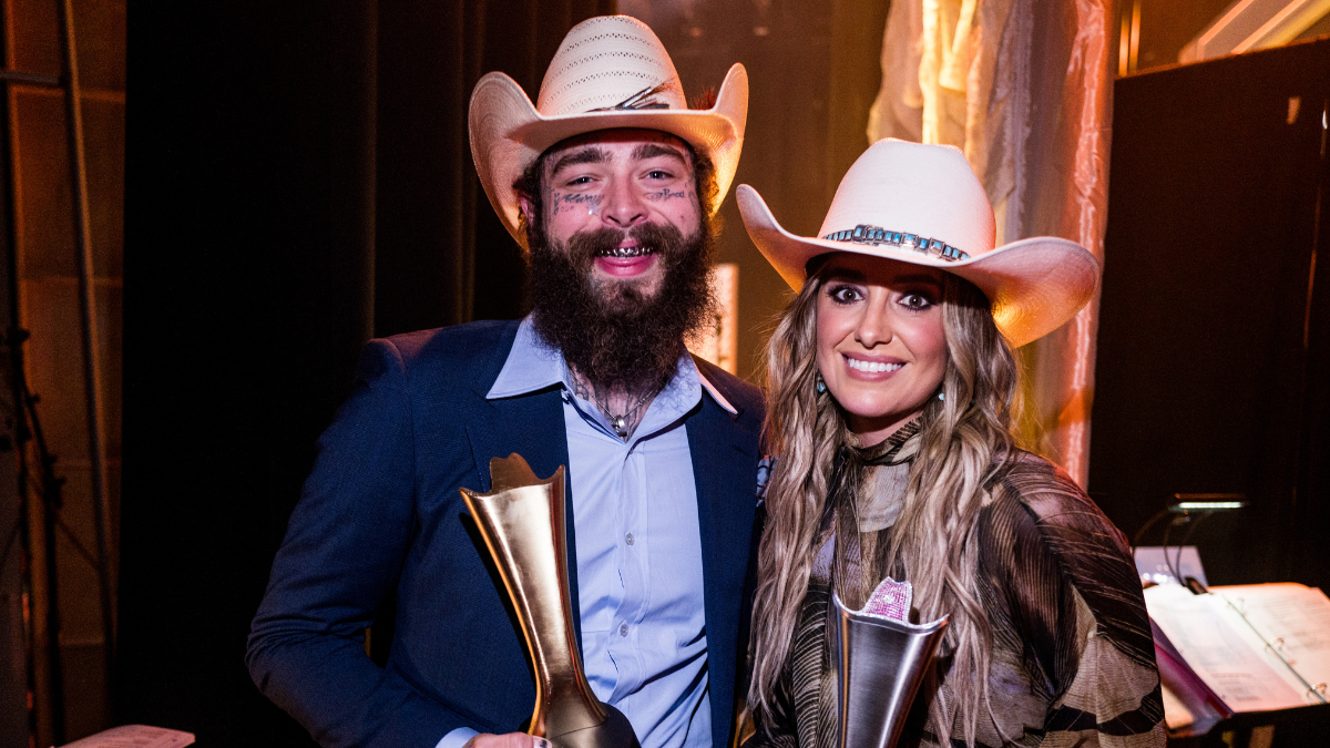 Watch Post Malone Surprise Lainey Wilson As She Makes History In Nashville | iHeartCountry Radio