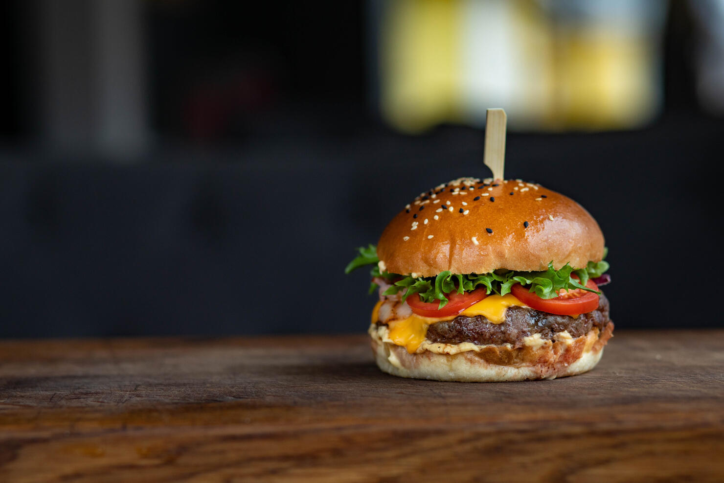 Close-up of burger on wooden table,Tondon Mamullu Makale Tana Toraja Regency,South Sulawesi,Indonesia